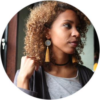 Luxe gold coin black ochre tassel art earrings