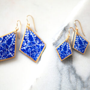 sapphire ink art diamond earrings gold trim - blurry